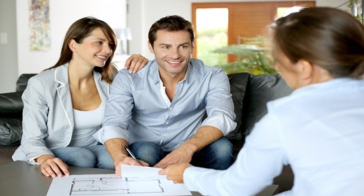 Couple signing financial terms for future property